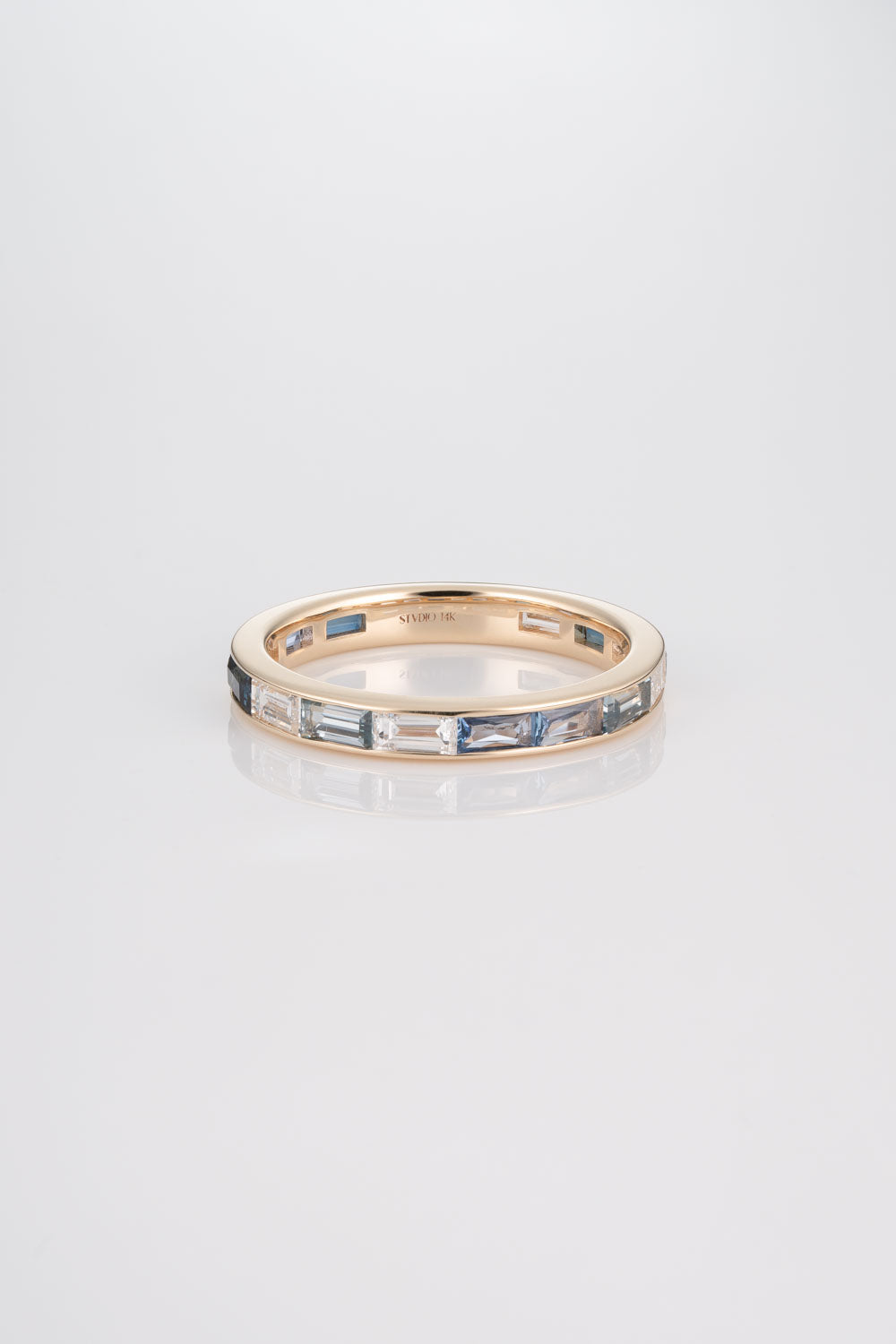 Channel Set Wedding Band with Australian Blue Sapphires, Yogo Sapphires, Light Montana Sapphires, and White Diamonds.