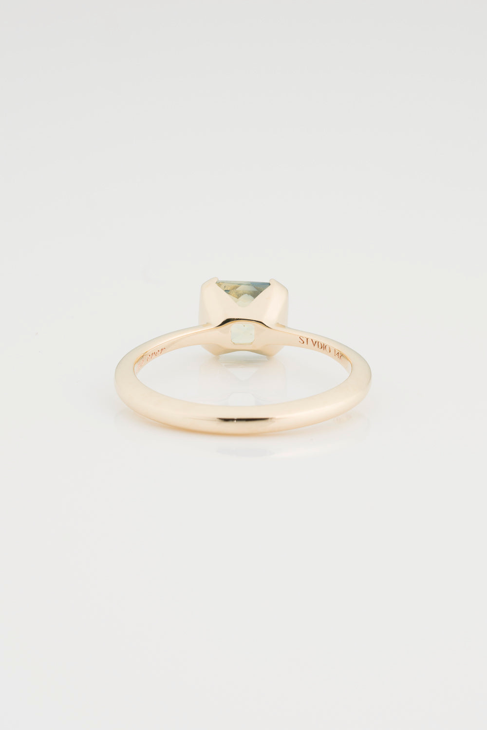 Custom 1.5 Carat Radiant Cut Sapphire Solitaire Engagement Ring. Setting has a split bezel and is set in a 14k Gold East West Setting. 