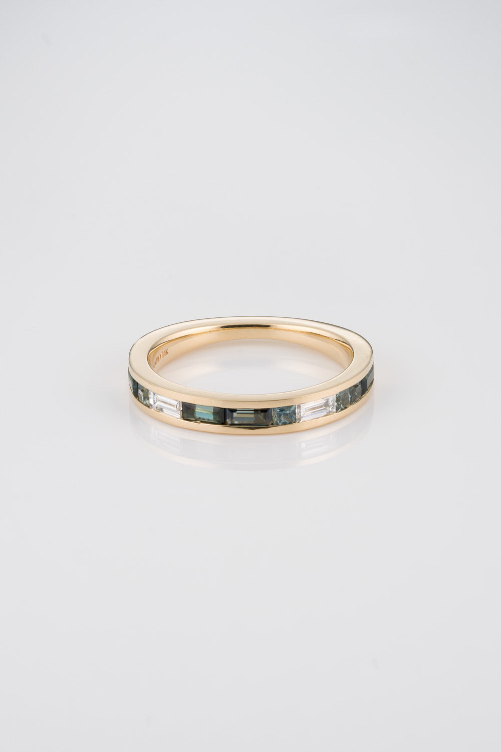 Channel Set 1/2 Eternity Mosaic Band with White Diamond Baguettes, Green Australian Sapphire Baguettes, and Green Australian Princess Cut Baguettes. 