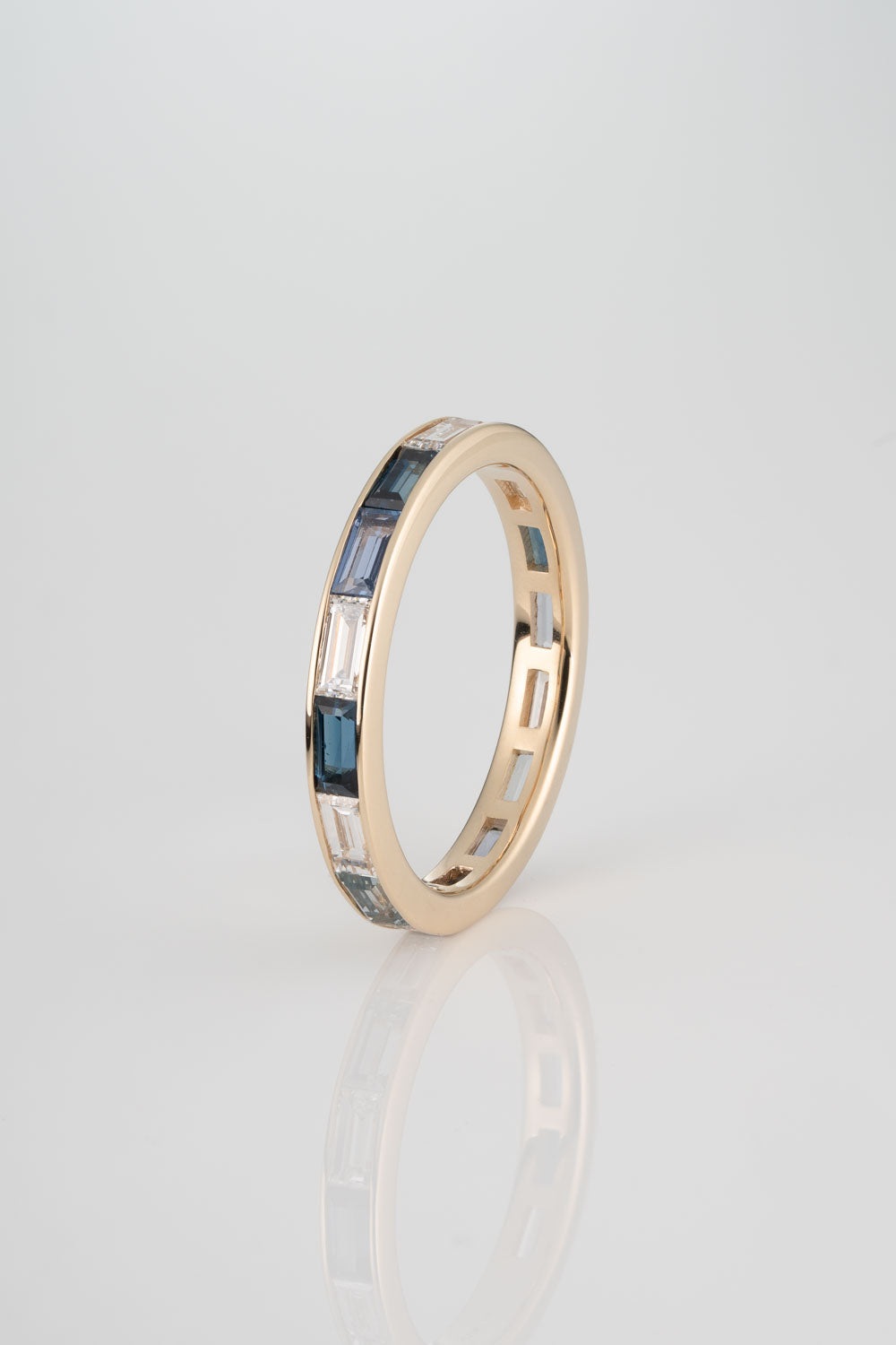 Channel Set Wedding Band with Australian Blue Sapphires, Yogo Sapphires, Light Montana Sapphires, and White Diamonds. 